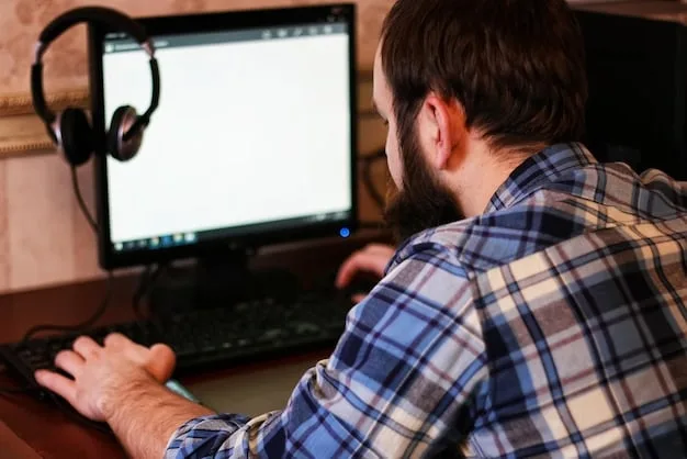 A person sitting in front of a computer screen showing video editing software (like DaVinci Resolve) with multiple video tracks and audio waveforms, illustrating the post-production process.