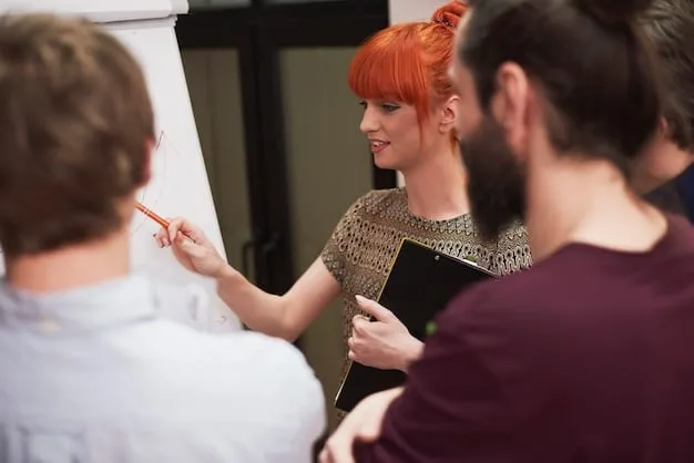 Students gathered around a museum exhibit, actively discussing and taking notes. A teacher is facilitating the discussion, highlighting key aspects of the exhibit.