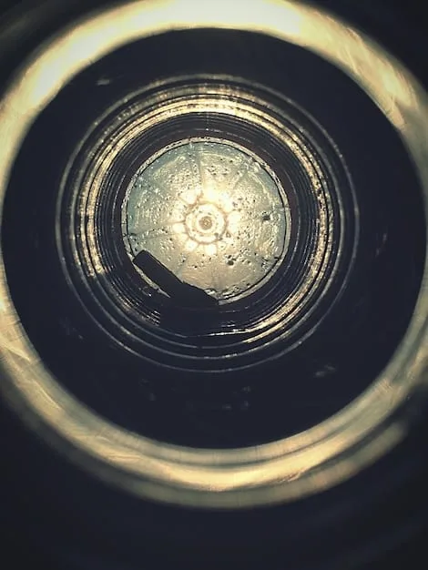 A close-up, stylized shot of a vintage film camera lens with light refractions, symbolizing the focus and artistic vision of alternative filmmaking.