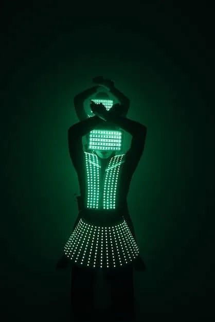 A futuristic tech-infused dress with integrated LED lighting. The dress is made from a shimmering, metallic fabric and features a network of tiny lights that can be programmed to display different colors and patterns.