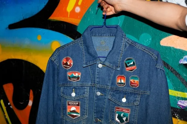 A person customizing a denim jacket with various patches and pins, showcasing different designs and textures. The person's hands are visible, carefully attaching a patch with needle and thread in a well-lit, creative studio setting.