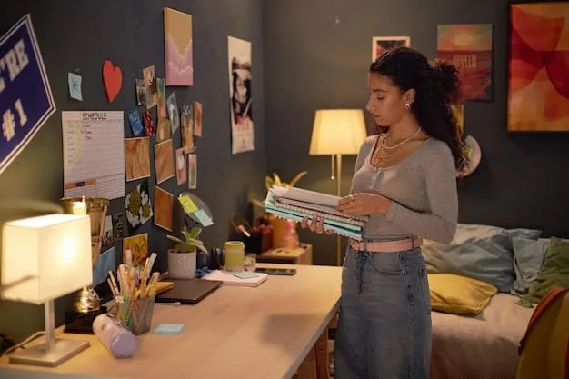 An artist meticulously organizing their receipts and financial documents in a home studio. The room is filled with art supplies, and a computer is open with tax preparation software displayed on the screen.