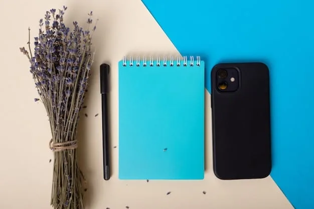A close-up shot of artist-designed merchandise, such as a phone case and a notebook, that showcases a cohesive branding strategy. The colors, fonts, and overall aesthetic align perfectly with the artist's signature style.