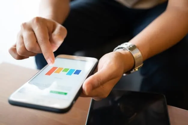A close-up shot of a smartphone displaying an Instagram analytics page, highlighting metrics such as follower growth, engagement rate, and reach percentages.