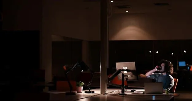 A musician sitting in front of a microphone in a home studio, recording a song. The room is dimly lit with creative lighting, creating a warm and inviting atmosphere.