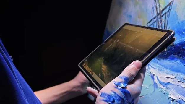 A close-up of an artist's hands meticulously arranging digital art pieces on an online portfolio website. The screen displays a modern and clean layout with high-resolution images of various artworks.