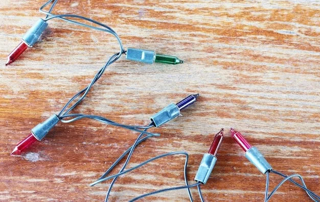 A close-up shot of a circuit board being intentionally manipulated with wires and soldering tools, creating a chaotic yet artistic arrangement. The image symbolizes the raw and hands-on approach to hardware manipulation in glitch art.