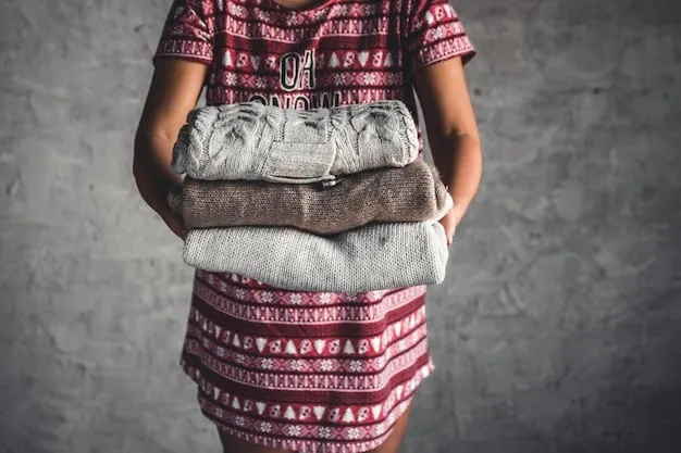 Close-up shot of hands sorting through a pile of old clothes at a thrift store, focusing on textures and patterns that could be repurposed into a new garment. A variety of fabrics are visible, including denim, cotton, and leather.