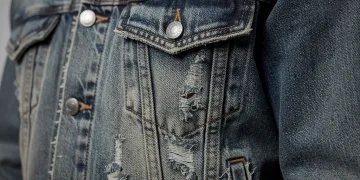 Distressed denim jacket showcasing 1990s industrial patina