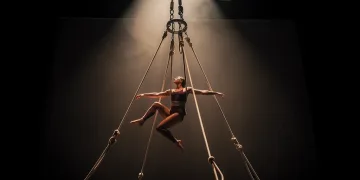 Suspension artist performing, showcasing modern rigging techniques and safety