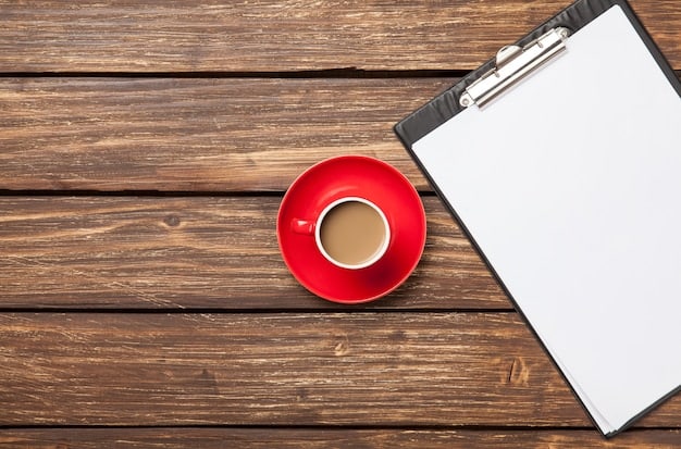 A detailed business plan document open on a table next to a laptop, a notebook, and a cup of coffee, symbolizing the planning phase of starting a venue.