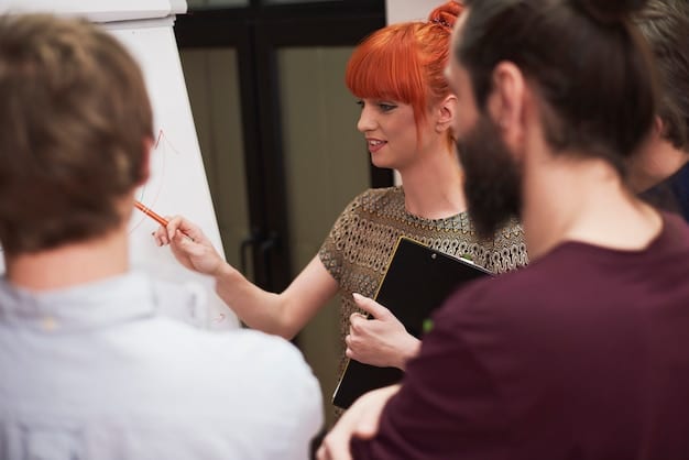 Students gathered around a museum exhibit, actively discussing and taking notes. A teacher is facilitating the discussion, highlighting key aspects of the exhibit.