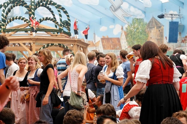 A panoramic shot of a large Renaissance fair with hundreds of participants dressed in period clothing. Various stalls are set up selling crafts, food, and weaponry. People are engaging in activities such as jousting, blacksmithing, and musical performances, creating a lively and authentic atmosphere of a historical village.