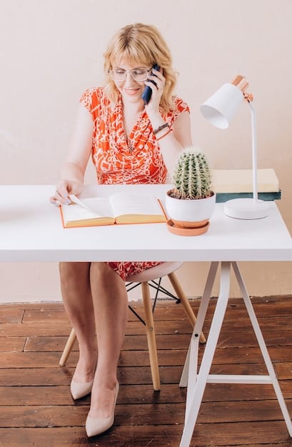 A woman sitting at a desk, writing a letter by hand. The desk is cluttered with paper, pens, and ink bottles, creating a vintage and artistic atmosphere. The woman appears focused and content, highlighting the satisfaction of engaging in traditional crafts in a digital world.