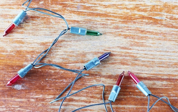 A close-up shot of a circuit board being intentionally manipulated with wires and soldering tools, creating a chaotic yet artistic arrangement. The image symbolizes the raw and hands-on approach to hardware manipulation in glitch art.