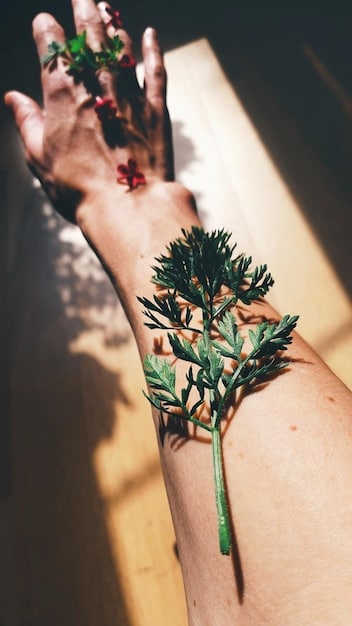 A close-up image showcasing deliberate scarification patterns on a person's arm, highlighting the artistic and symbolic nature of the self-inflicted markings.