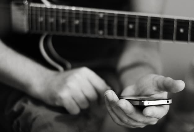 A close-up shot of an emerging musician's hands playing a guitar with social media icons subtly overlaid, symbolizing the integration of music and social media marketing.