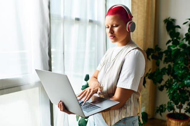 A person using a laptop to research music playlists and curators, with headphones on and a focused expression, illustrating the importance of diligent research.