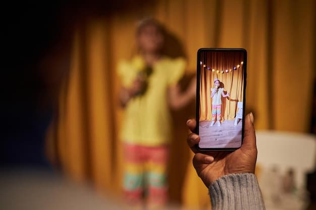 An artist on stage performing at a small venue, with the audience holding up their smartphones to record and share the performance on social media.