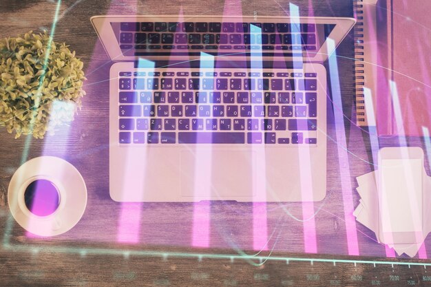 A close-up of a laptop screen displaying keyword research tool results, showing data on search volume, competition, and related keywords. The screen is brightly lit, highlighting the data points.