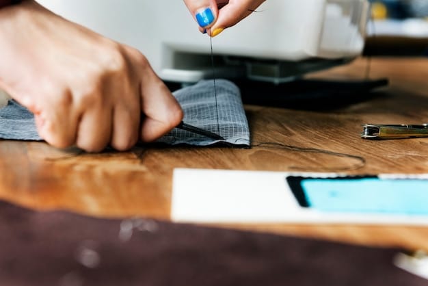 A person using a sewing machine to attach a patch onto a piece of upcycled denim, showcasing the process of adding personalized embellishments to a garment. The focus is on the hands at work and the details of the sewing process.