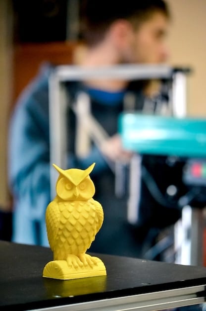 A brightly lit workshop where a designer is using a 3D printer to create a complex piece of wearable art. The area is clean and organized with several other projects in progress, illustrating the innovative and hands-on process.