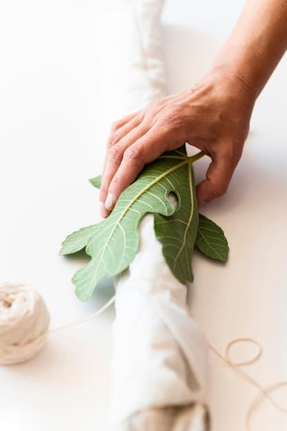 A close-up shot of a designer's hands creating a garment using repurposed materials, emphasizing the DIY and sustainable aspects of underground fashion.