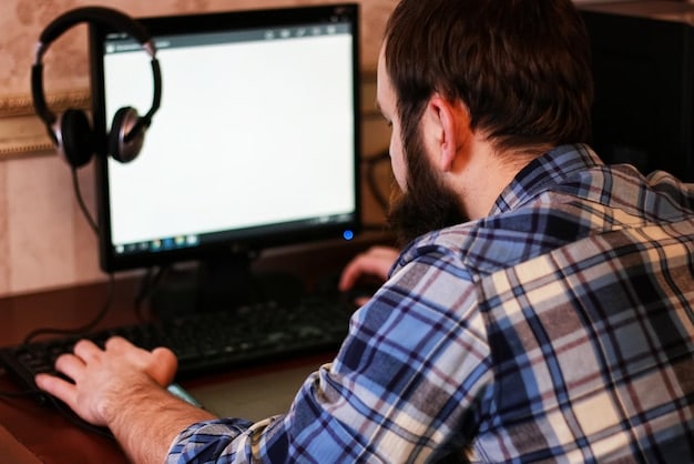 A person sitting in front of a computer screen showing video editing software (like DaVinci Resolve) with multiple video tracks and audio waveforms, illustrating the post-production process.