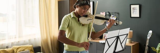A split image showing an emerging artist in a home studio creating music on one side, and their avatar projected onto a large virtual stage screen with a cheering digital audience on the other, symbolizing the transition from creation to virtual performance.