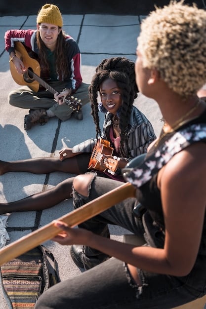 A diverse group of emerging musicians and poets gathered at a vibrant community center, sharing ideas and collaborating during a local arts collective meeting.