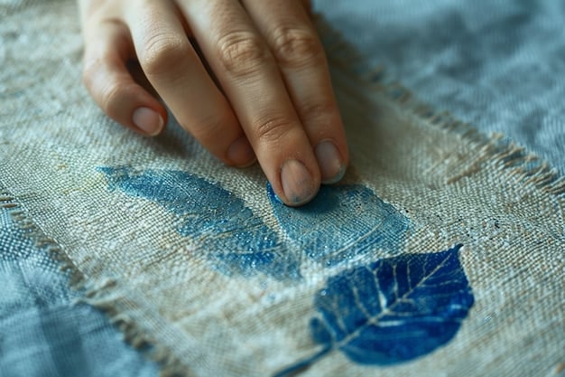 A close-up shot of a person's hands meticulously stitching together two contrasting fabric swatches, demonstrating a DIY approach to fashion design, with a vintage sewing machine blurred in the background.