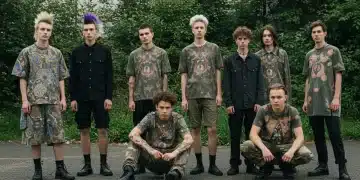 Diverse individuals showcasing sustainable alternative apparel in an urban green setting, embodying eco-conscious subcultures.